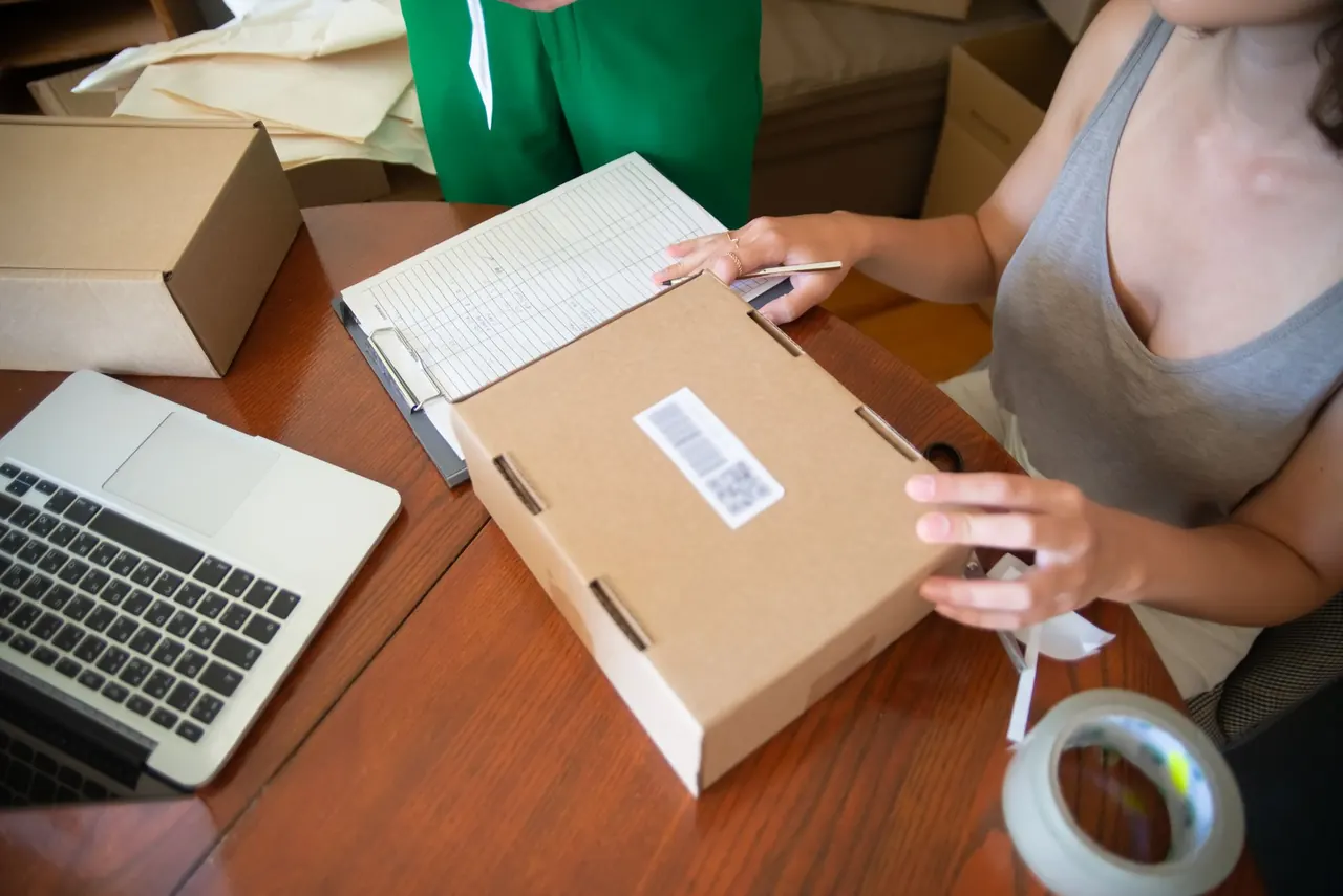 An e-commerce team processing inventory and packing customer orders