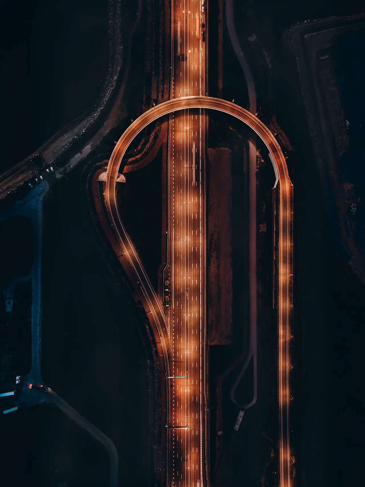 An illuminated infrastructure interchange viewed from above